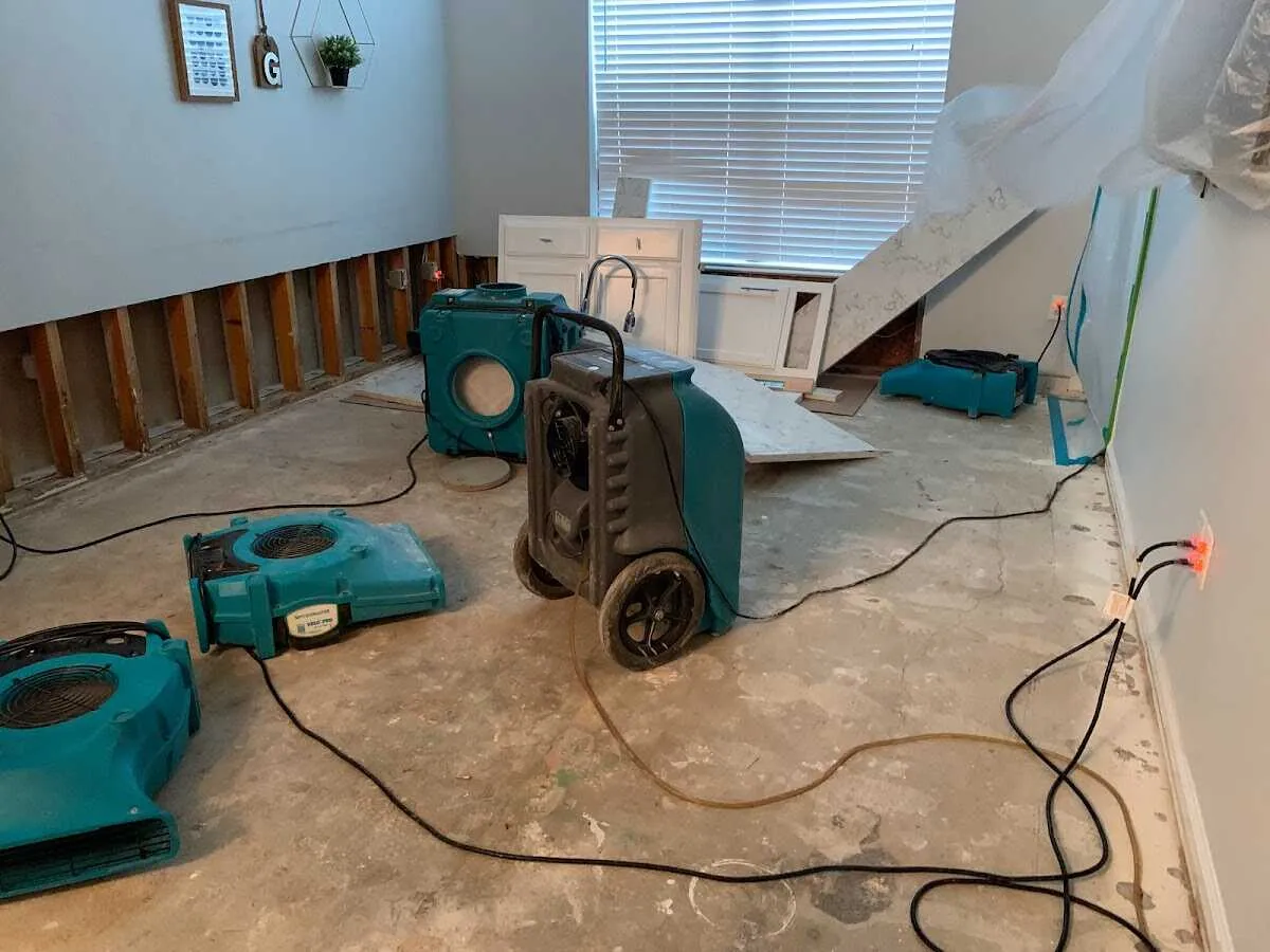 Dehumidifier in flood-cut room for Water Damage Restoration in Candler-McAfee